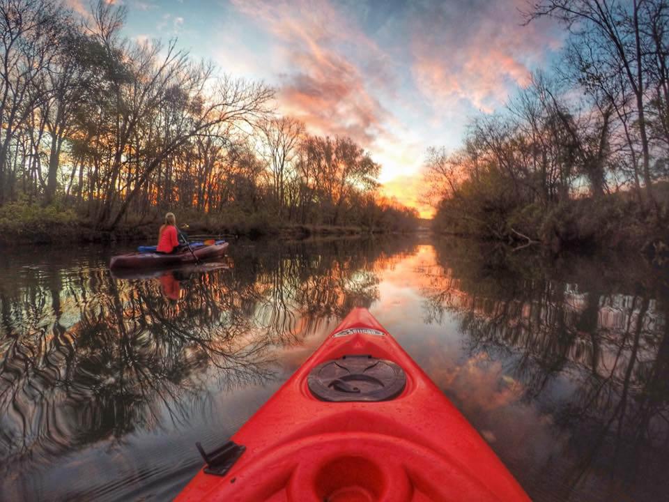 kayak on lake at sunset